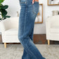 Side view of Judy Blue mid rise release hem jeans in medium wash.
