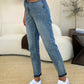 Full-length view of Judy Blue Mid Rise Rigid Magic Release Hem Jeans.