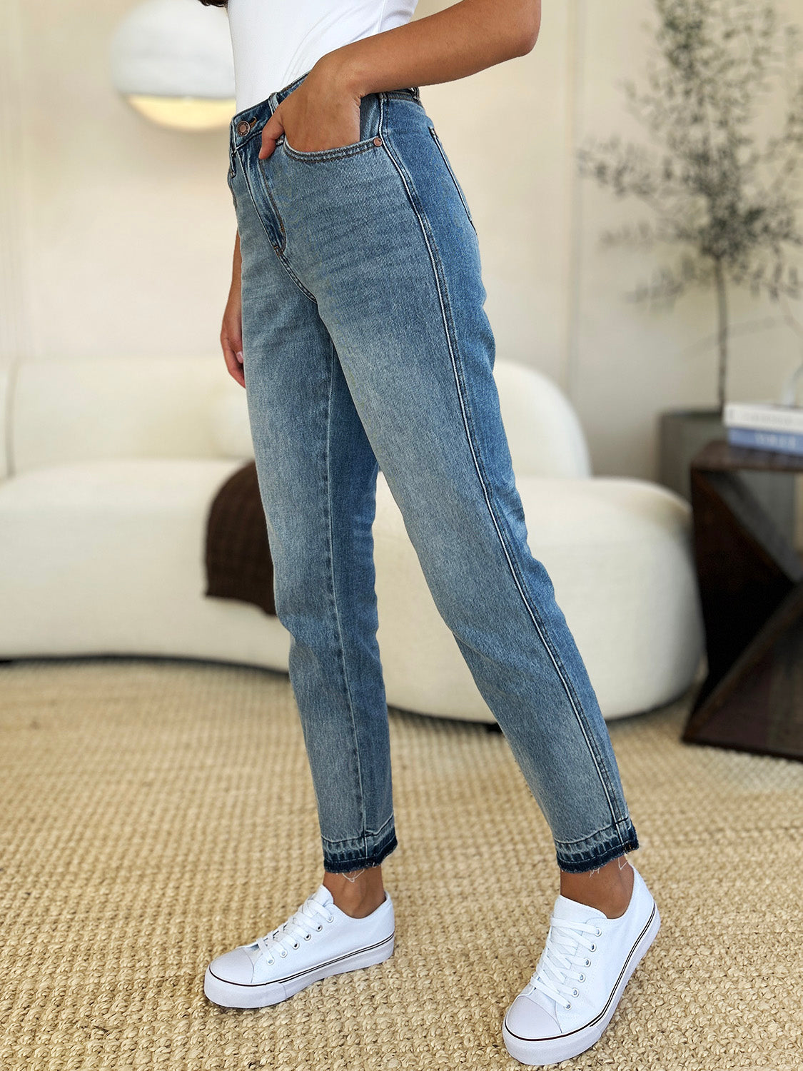 Full-length view of Judy Blue Mid Rise Rigid Magic Release Hem Jeans.