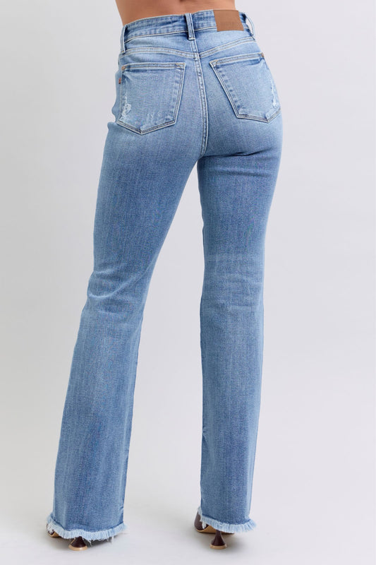 Back view of Judy Blue Raw Hem High Rise Bootcut Jeans with functional pocket details and high-rise design.
