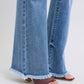 Raw hem closeup of Judy Blue Raw Hem High Rise Bootcut Jeans emphasizing edgy, modern design.
