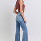 Styled outfit with Judy Blue Raw Hem High Rise Bootcut Jeans paired with heels for a chic, polished look.
