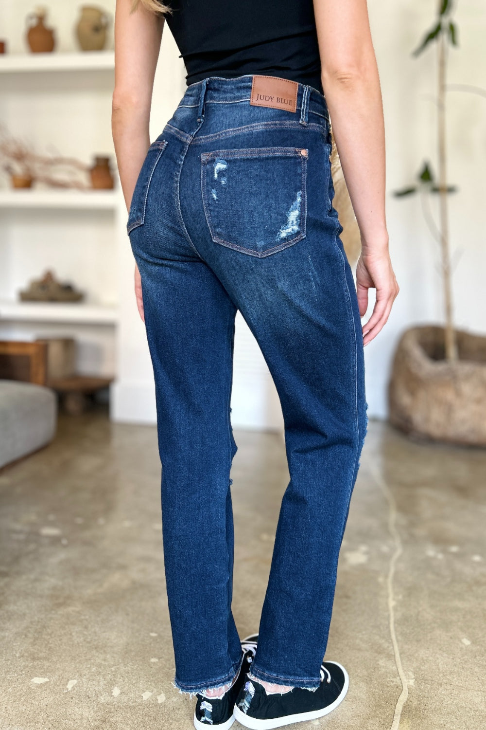 Dark wash Judy Blue straight jeans with heavy distressing and high waist.