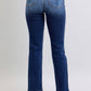 Back view of Judy Blue straight-leg jeans with functional pockets and tailored stitching.
