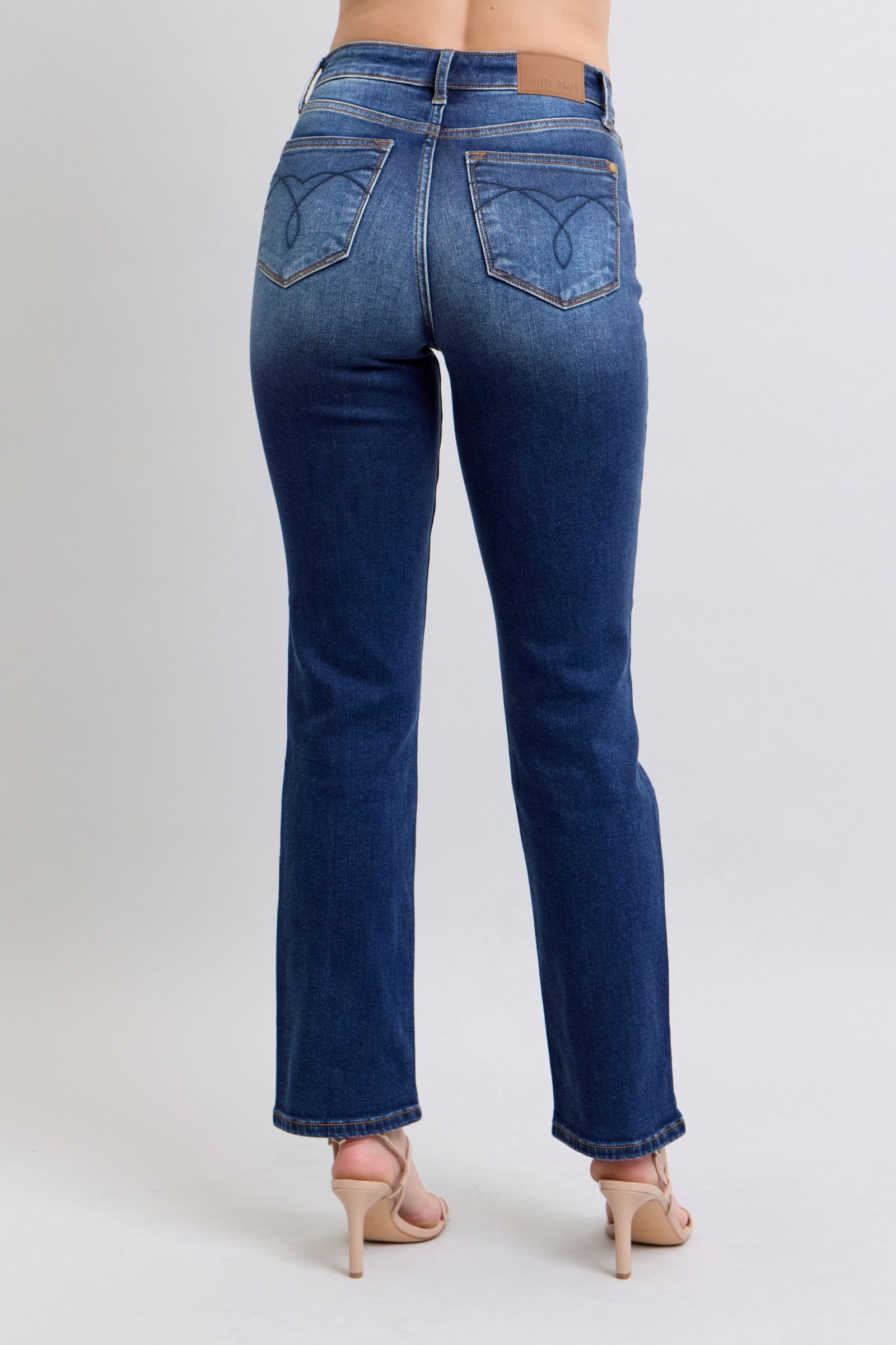 Back view of Judy Blue straight-leg jeans with functional pockets and tailored stitching.
