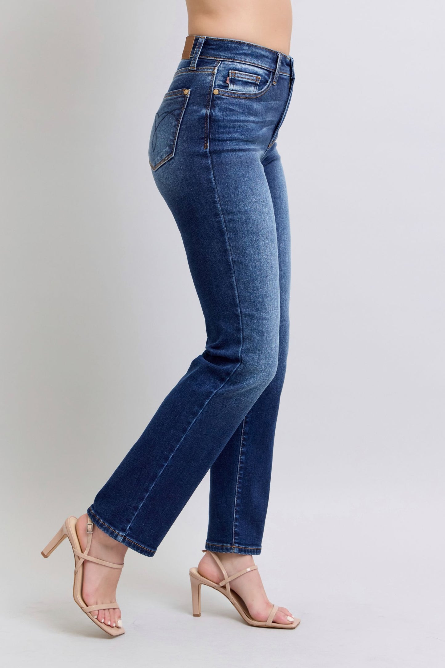 Side profile of Judy Blue straight-leg jeans in dark wash highlighting the classic straight-leg cut.
