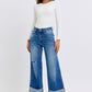 Judy Blue medium wash jeans featuring wide-leg silhouette
