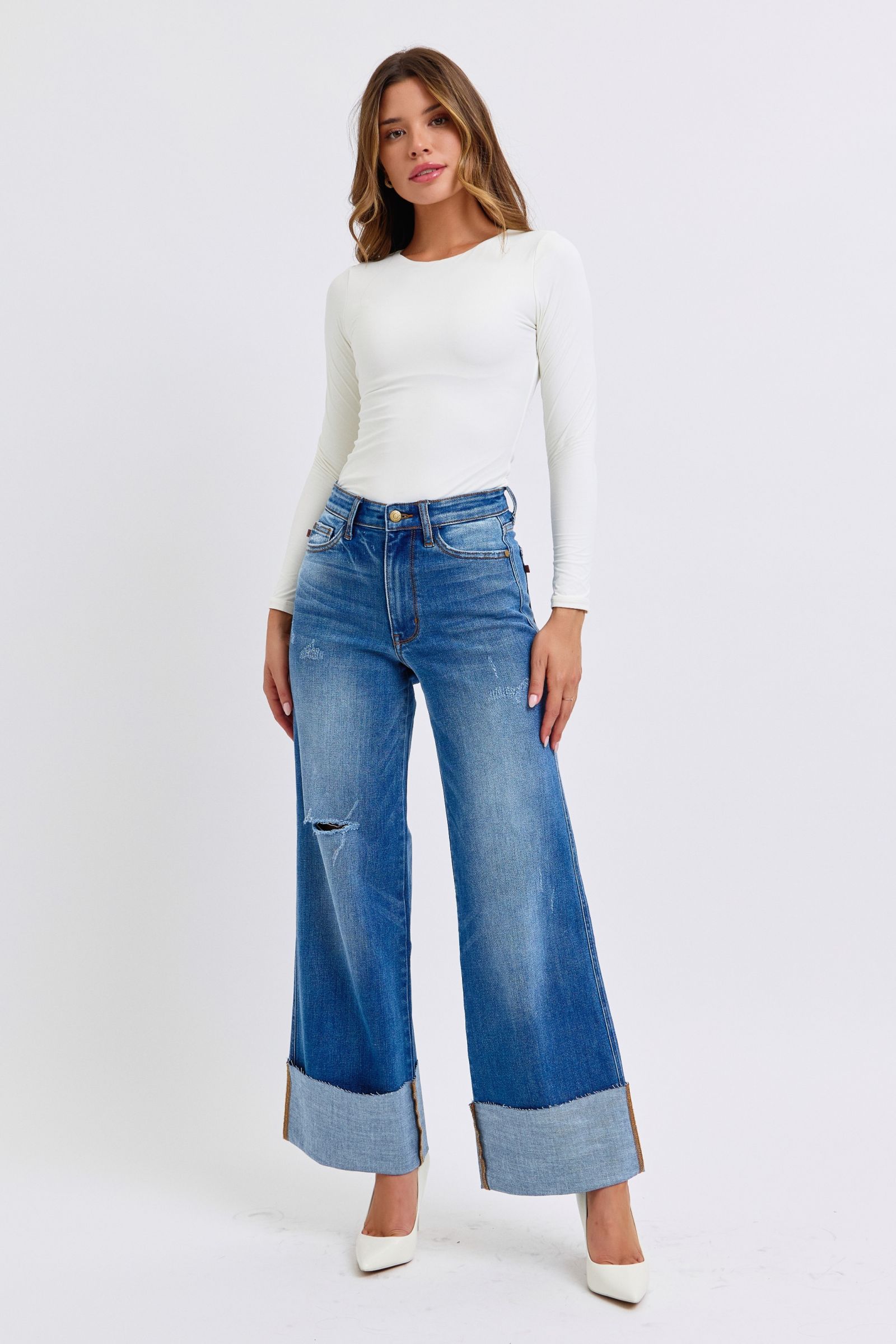 Judy Blue medium wash jeans featuring wide-leg silhouette
