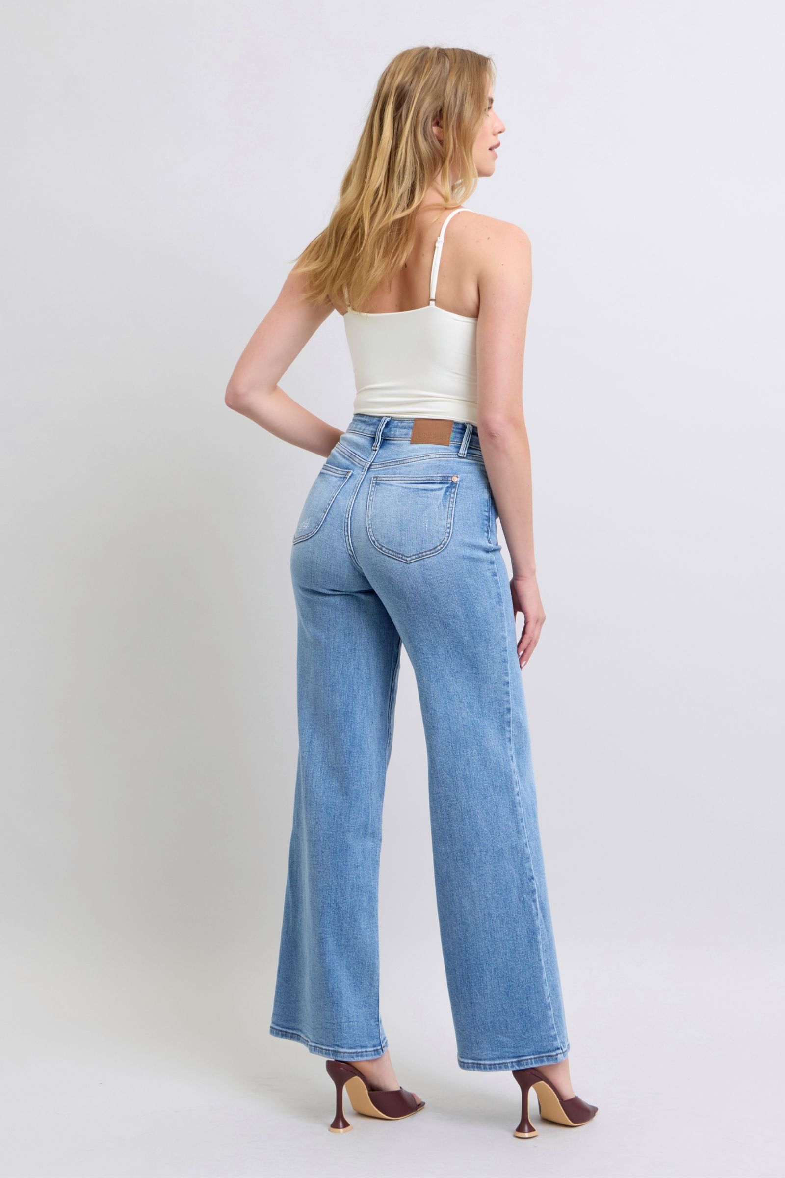 Belt loop detail on Judy Blue wide leg jeans highlighting the structured waistband.
