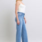 Full-length display of Judy Blue wide leg jeans in light wash for a modern, relaxed look.
