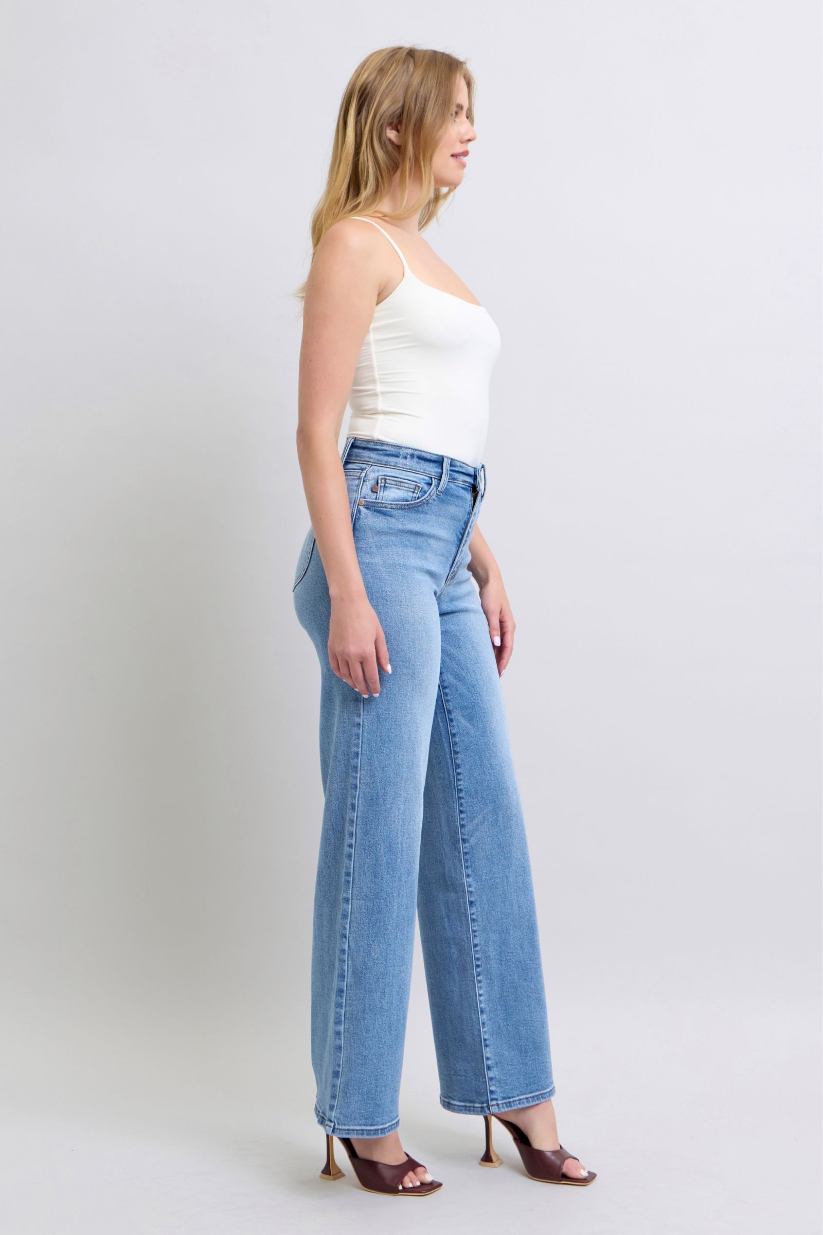 Full-length display of Judy Blue wide leg jeans in light wash for a modern, relaxed look.
