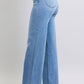 Side profile closeup of Judy Blue wide leg jeans featuring clean seams and relaxed fit.
