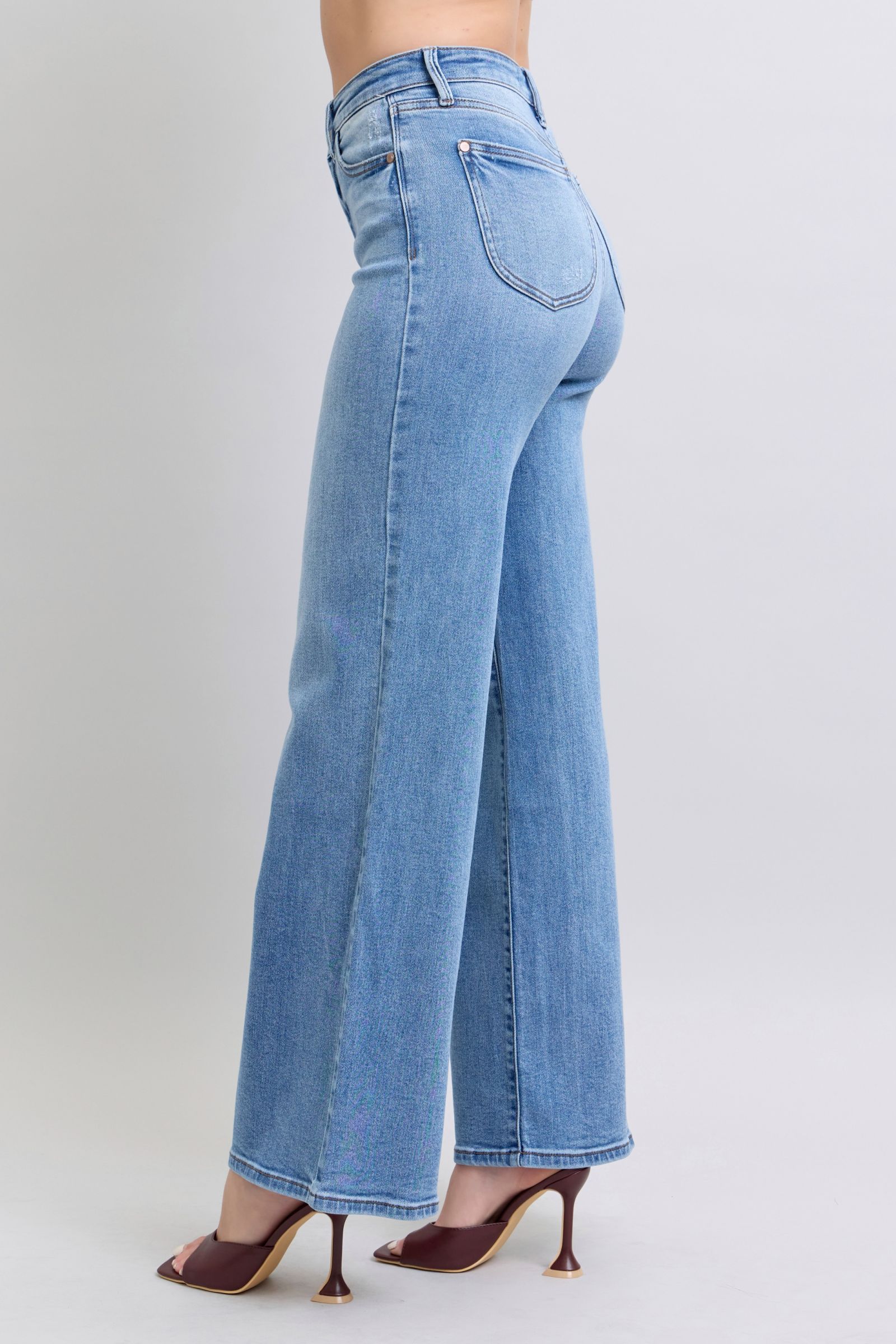 Side profile closeup of Judy Blue wide leg jeans featuring clean seams and relaxed fit.
