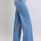 Side view of Judy Blue wide leg jeans in light wash highlighting pocket detail.
