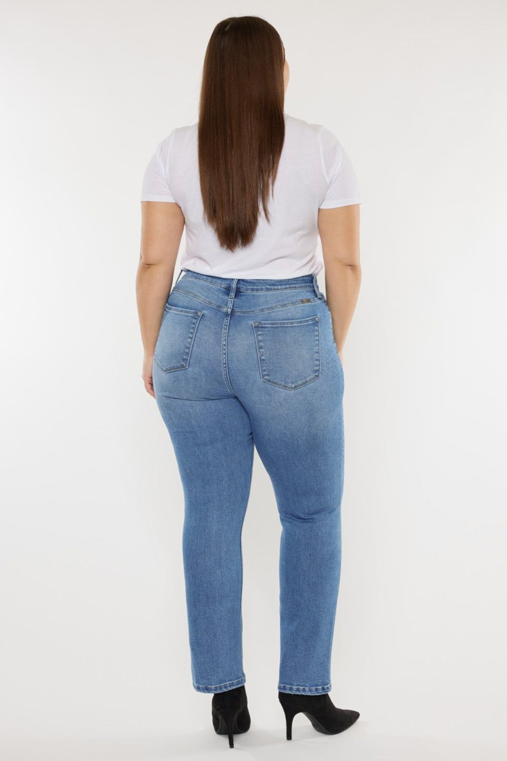 Model wearing Kancan Cat's Whiskers High Waist Jeans demonstrating the fit and style.