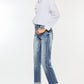 Distressed details on the Kancan High Rise Cuffed Straight Jeans adding a trendy touch to the denim.