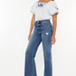 Kancan slim wide leg jeans in medium blue with a high waist and stylish raw hem.
