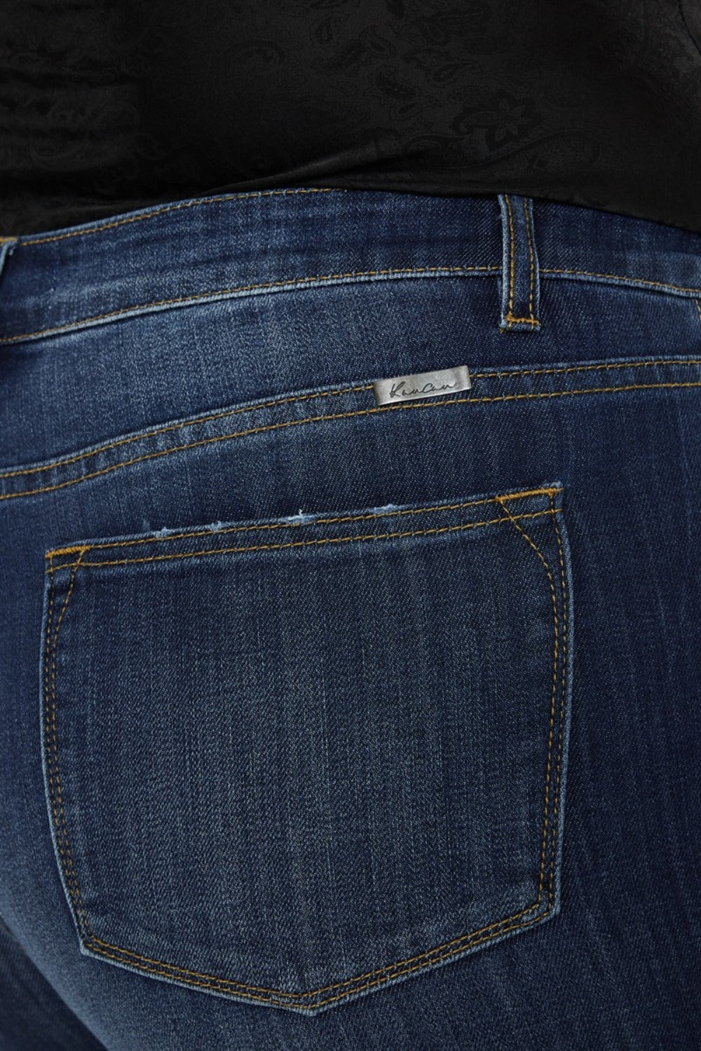 Close-up of dark wash Kancan flare jeans with slight stretch
