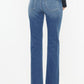 Back view of Kancan jeans featuring slim straight fit and raw hem design.
