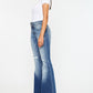 Women's wide waistband jeans with flared leg, distressed style, and medium wash.
