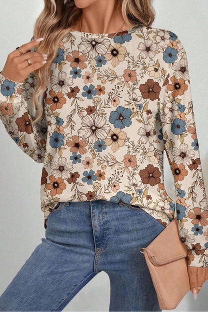 Women’s khaki floral top featuring a crew neck and soft, durable fabric.
