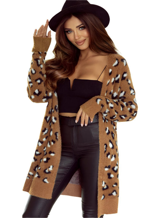 Woman wearing a soft leopard print fur cardigan
