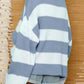 Light blue ribbed knit sweater with white stripes for a classic look.
