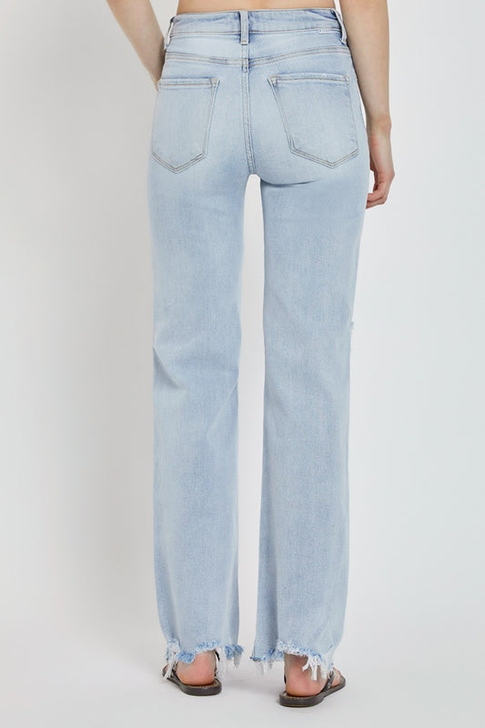 RISEN high-rise wide leg jeans featuring distressed detailing and frayed hemline
