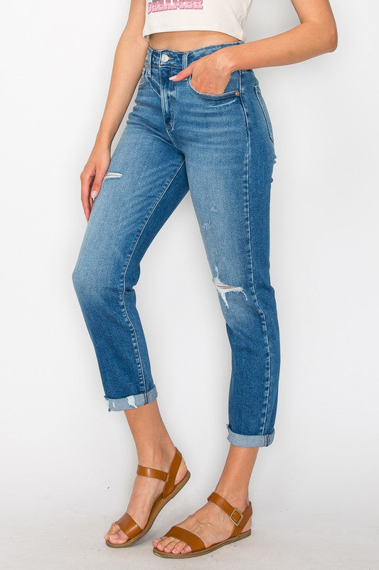 Plus-size cuffed tapered leg jeans with a high-rise waist and distressed details.
