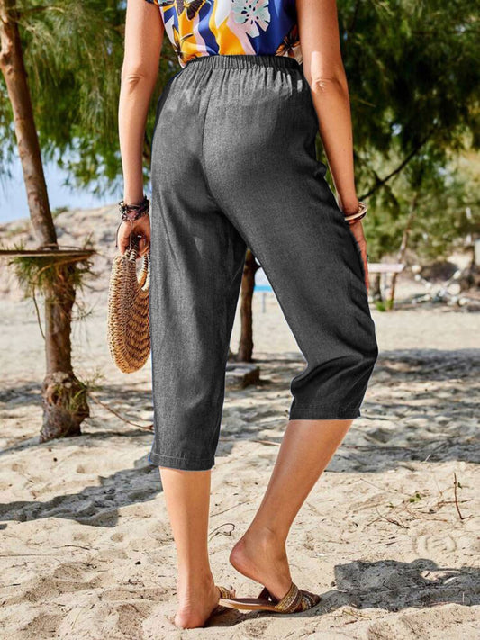 Women's gray cropped pants with a comfortable elastic waistband.