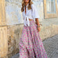 Lightweight pink bohemian maxi skirt perfect for spring-summer resort wear.






