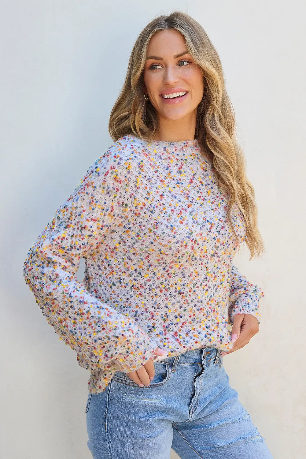 Casual confetti knit sweater with multicolored speckles and ribbed hem