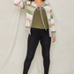 Olive cardigan featuring a tie-front design and colorful striped pattern.