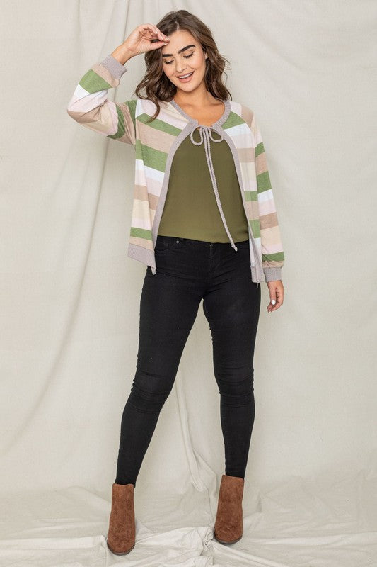 Olive cardigan featuring a tie-front design and colorful striped pattern.