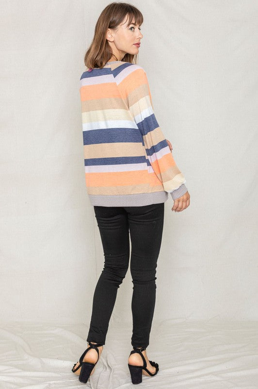 Lightweight orange cardigan with tie-front closure and contrasting stripes.