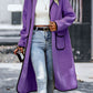 Elegant long sherpa coat in purple with stylish contrast trim.
