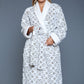 Long-sleeve sherpa robe with a damask pattern, designed for warmth and style.
