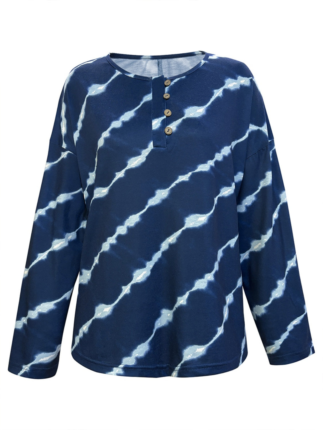 Long sleeve tie-dye button top in blue and white, styled with denim for a casual look.
