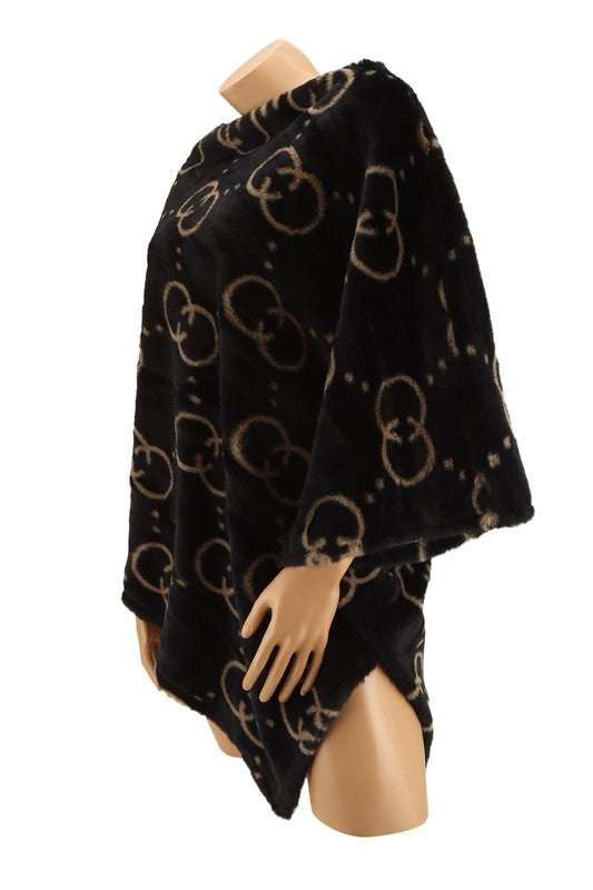 patterned black poncho in soft fleece material
