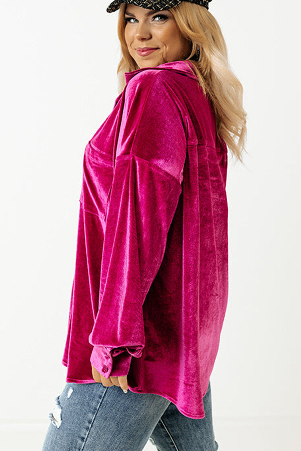 Elegant magenta velvet shirt styled for plus-size fall fashion.





