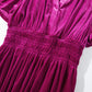 Magenta velvet maxi dress showcasing soft fabric and flattering silhouette
