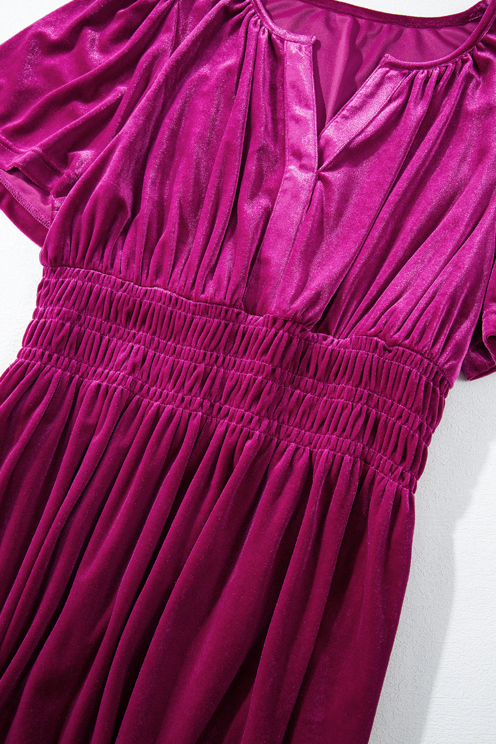 Magenta velvet maxi dress showcasing soft fabric and flattering silhouette
