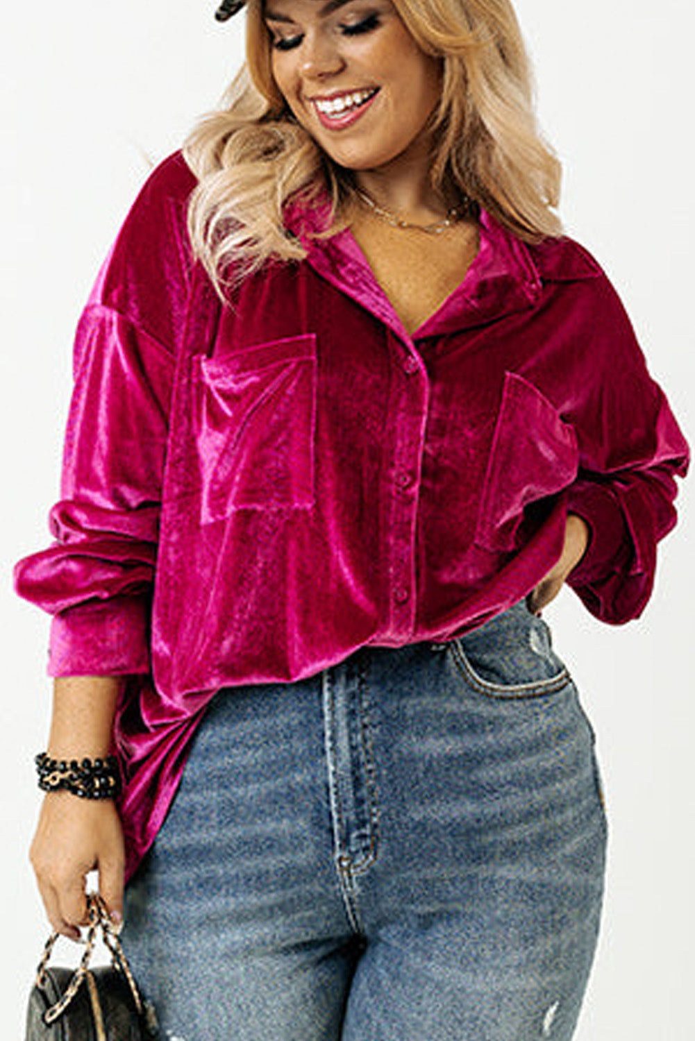 Vibrant magenta velvet button-down shirt with functional chest pockets.
