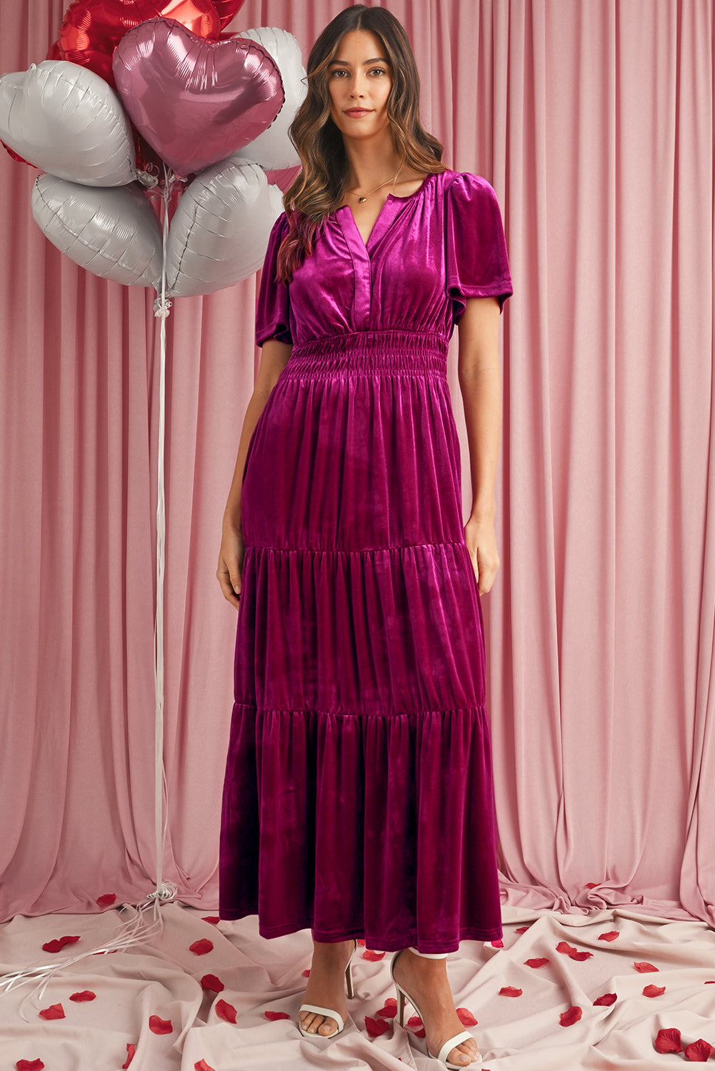 Luxurious magenta velvet maxi dress featuring a shirred waist and pockets
