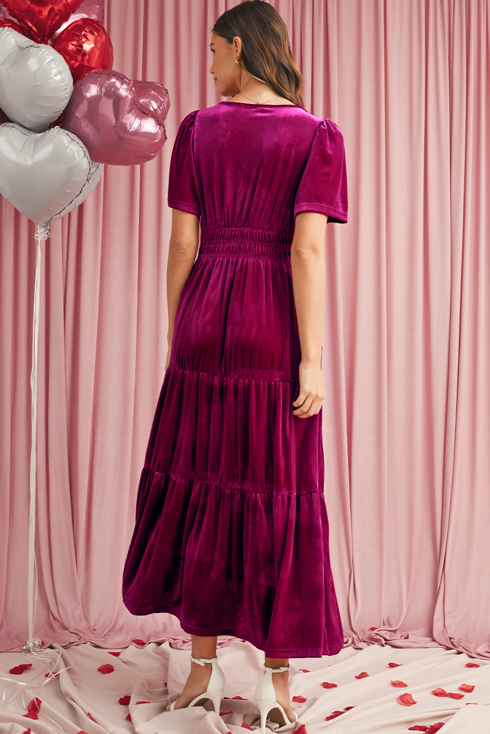 Back view of magenta velvet tiered maxi dress with short sleeves
