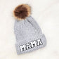 Warm gray knit beanie featuring a chenille mama patch and fluffy pom
