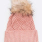 Mauve cable knit beanie with chic detachable faux fur pom pom
