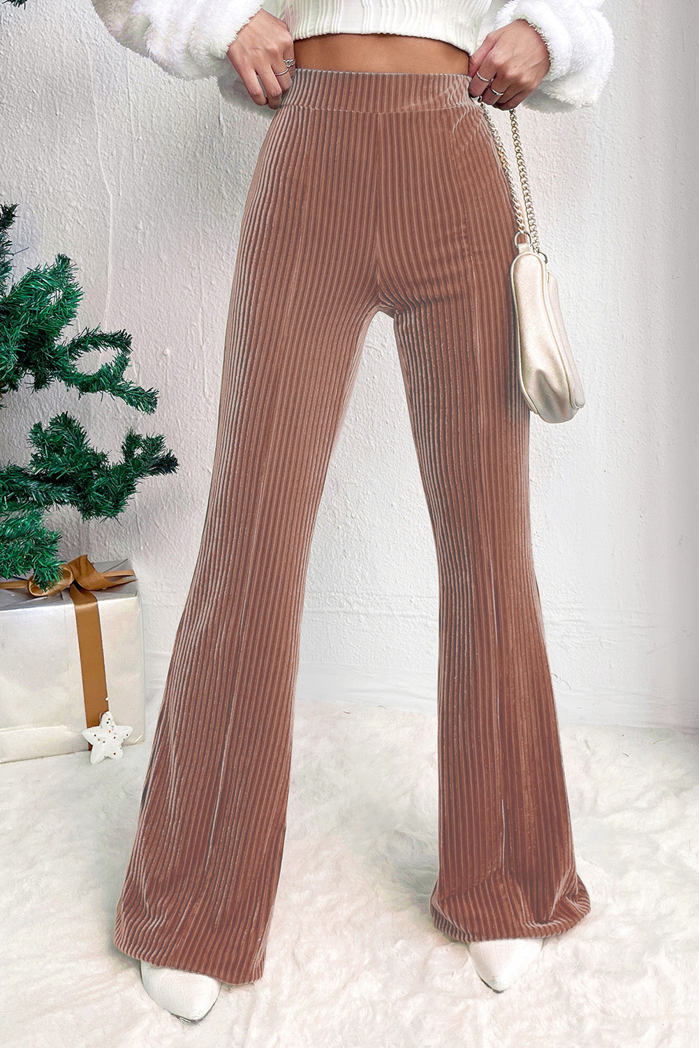 High-waist corduroy flare pants in mauve for a chic, vintage look.
