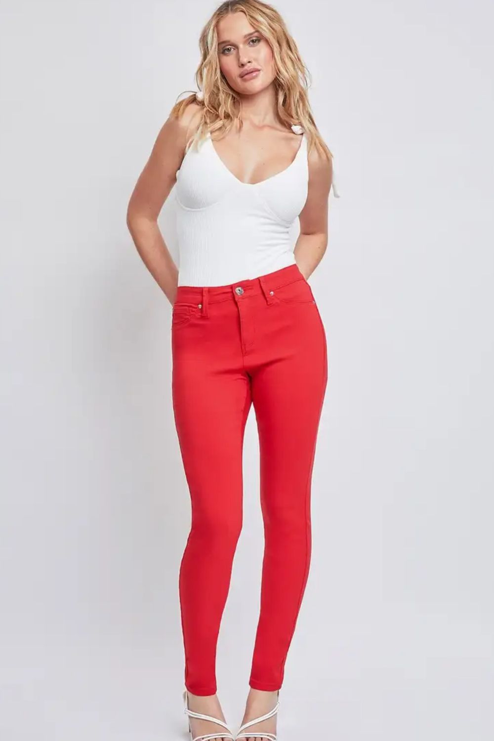 Women’s stretchy red skinny jeans styled for casual and dressy looks.
