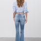 Insane Gene mid-rise light distressed crop flare jeans with frayed hem.